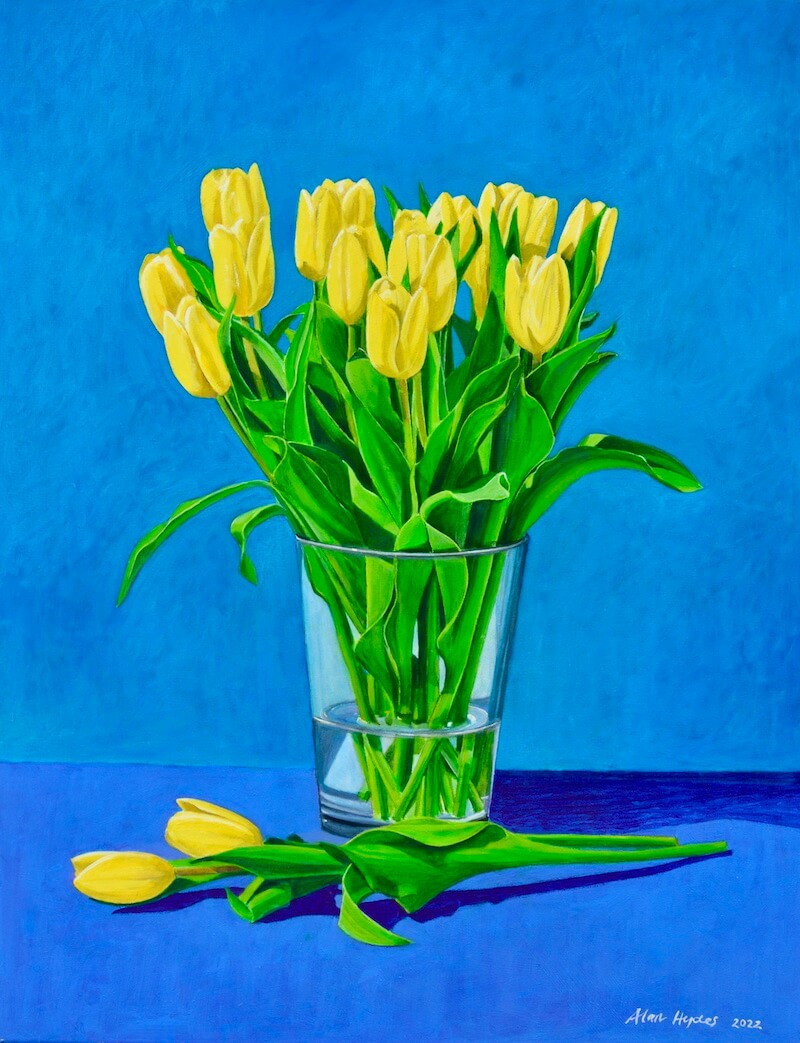 yellow tulips in glass vase